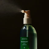 Aromatica Rosemary Root Enhancer being sprayed