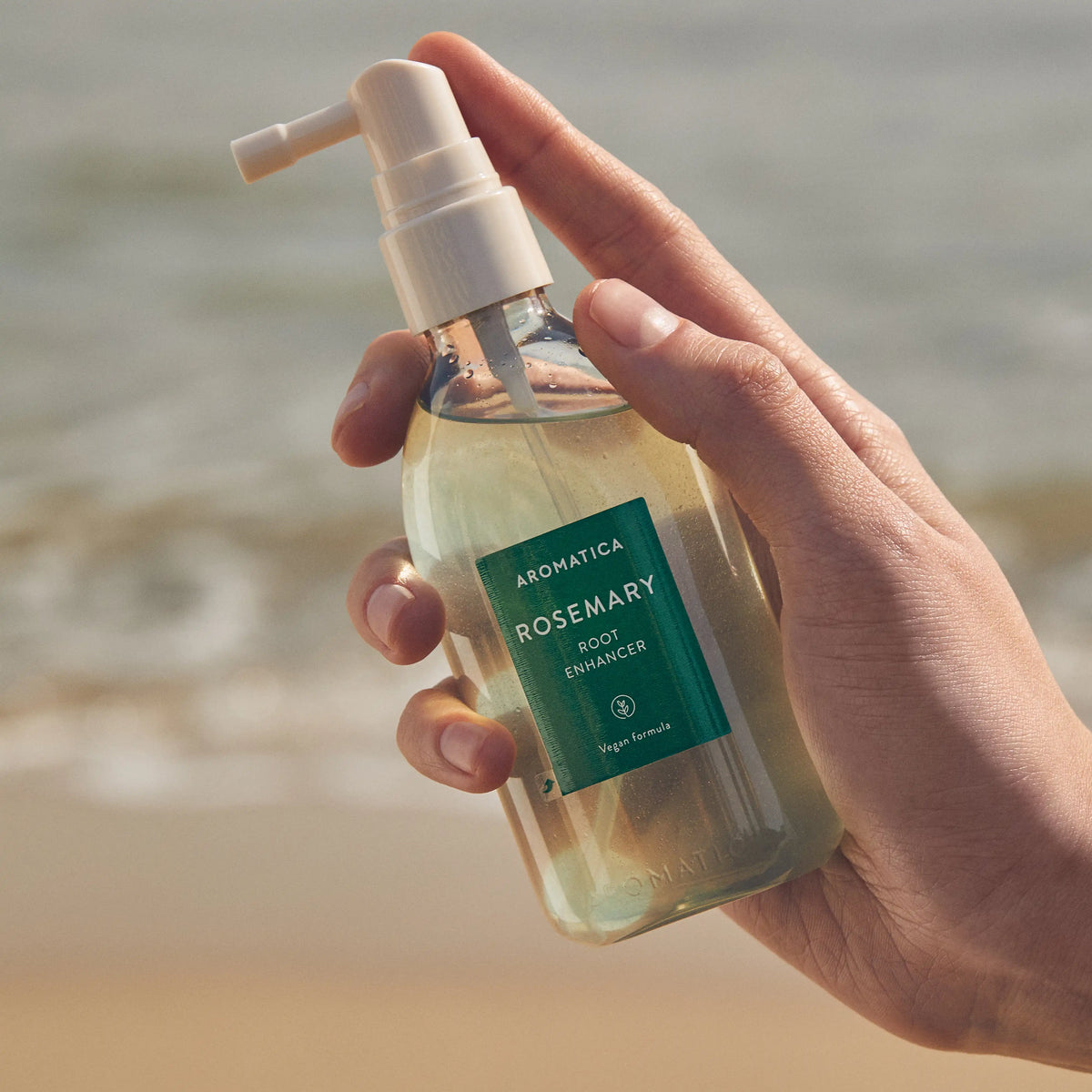 Aromatica Rosemary Root Enhancer 100ml held in hand
