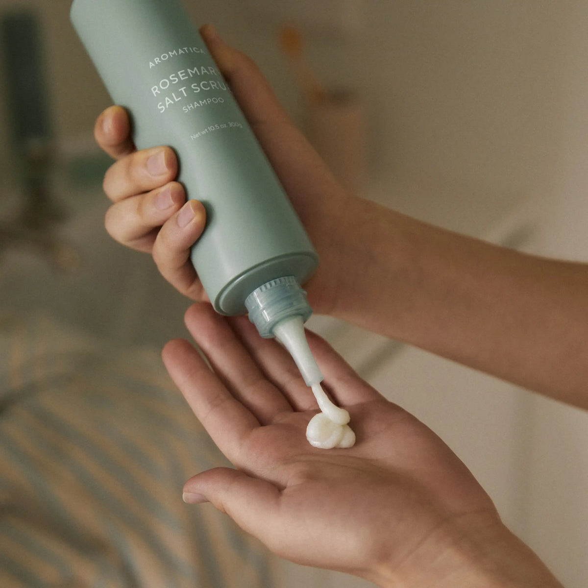 Aromatica Rosemary Salt Scrub Shampoo squeezed from tube showing texture