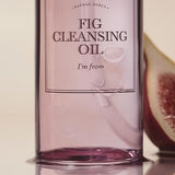 I'm From Fig Cleansing Oil 200ml bottle close-up with fresh figs in background