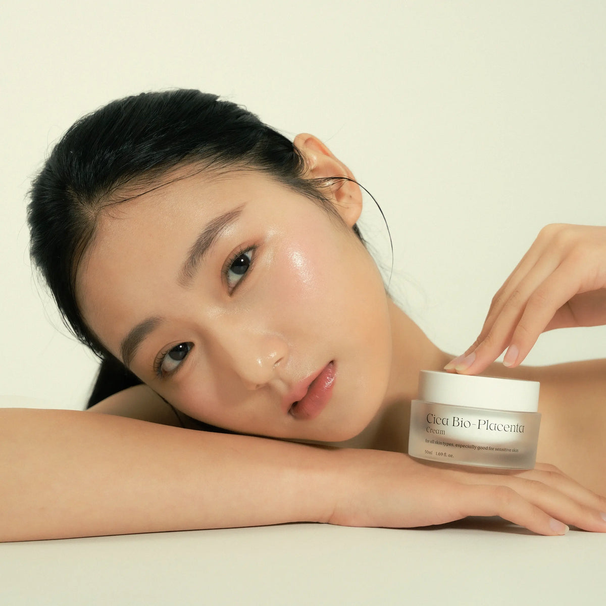 Model with clear hydrated skin using NDP Cica Bio-Placenta Cream for soothing sensitive skin