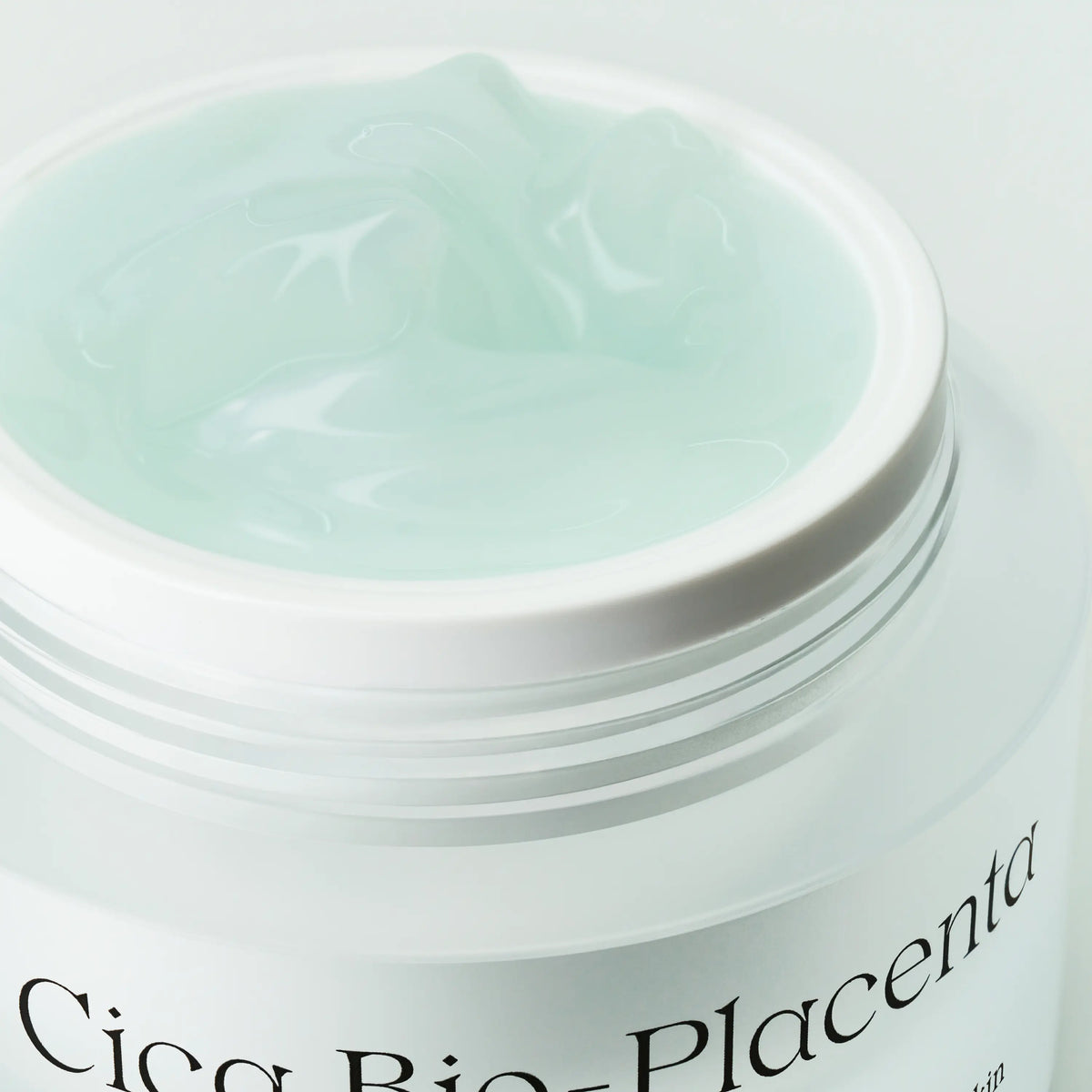 Close-up of NDP Cica Bio-Placenta Cream showing lightweight gel texture with soothing and hydrating finish