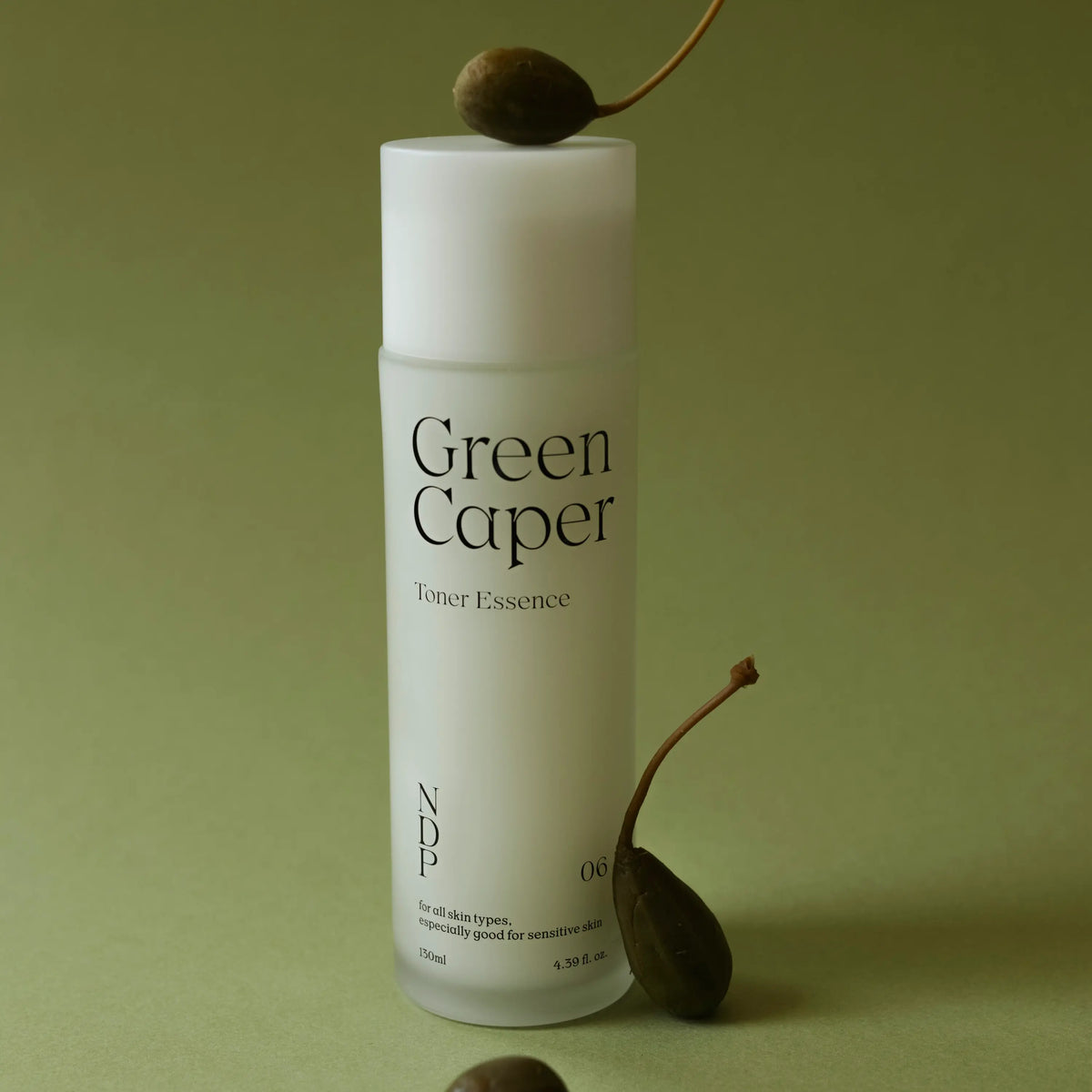 NDP Green Caper Toner Essence in a clean skincare routine setting for simple hydration step