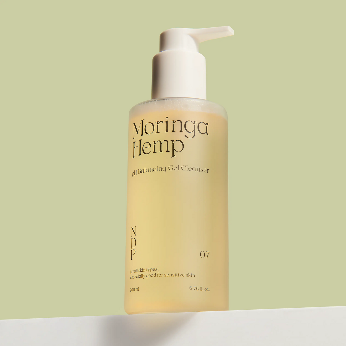 NDP Moringa Hemp pH Balancing Gel Cleanser 200ml bottle on a green background