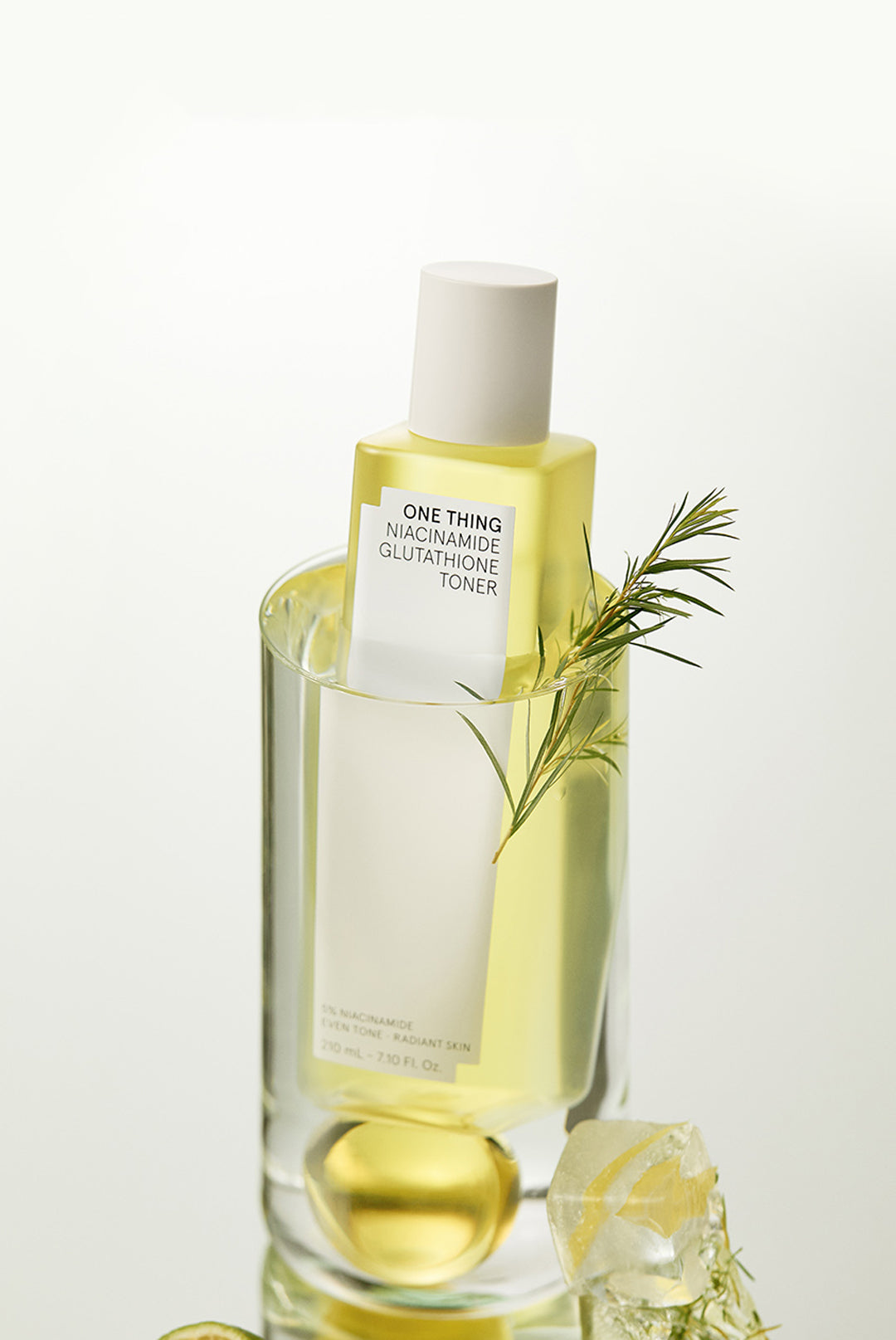 One Thing Niacinamide Glutathione Toner bottle submerged in water