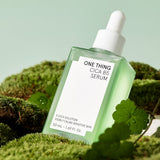 One Thing Cica B5 Serum 50ml bottle on green plant