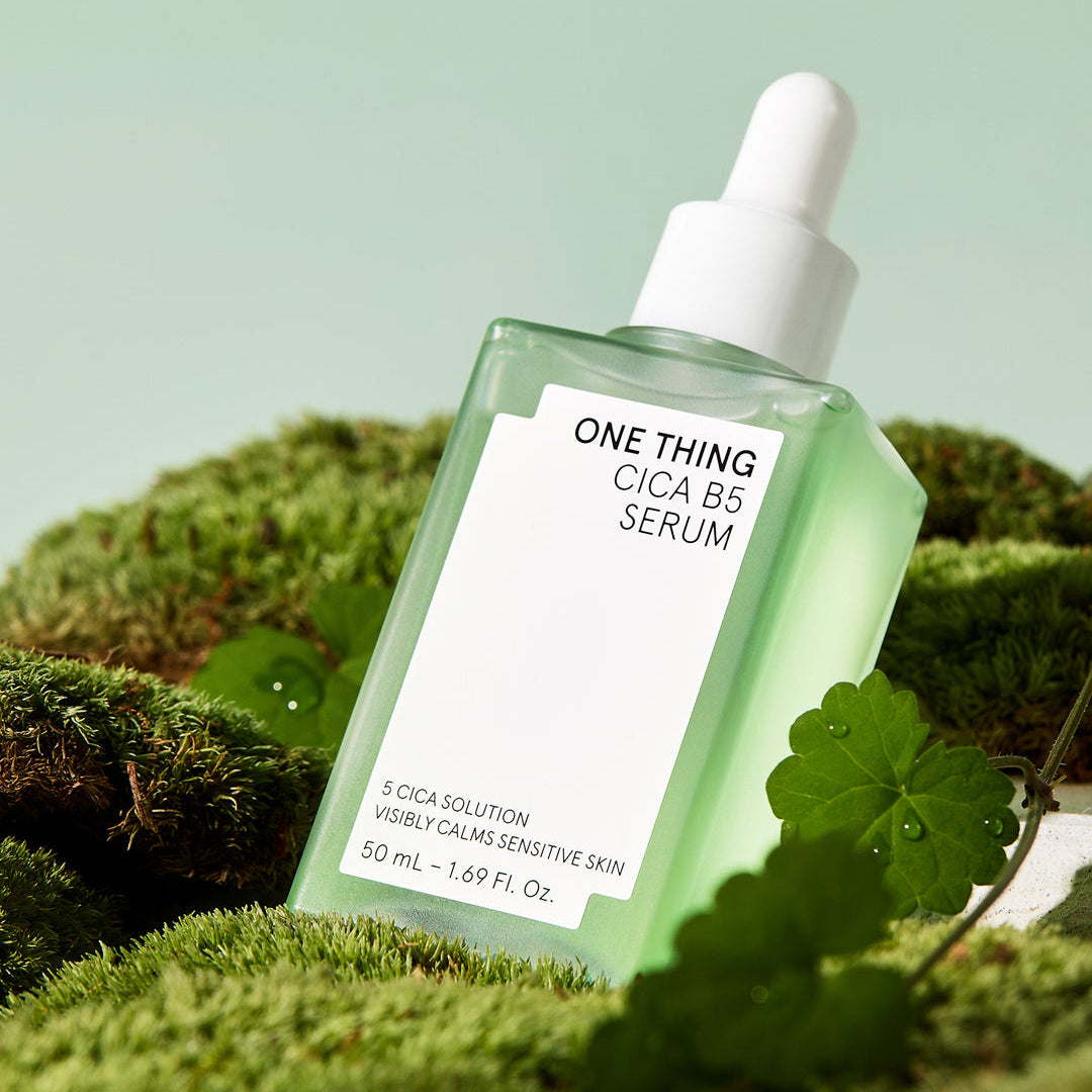 One Thing Cica B5 Serum 50ml bottle on green plant