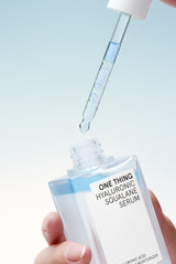 One Thing Hyaluronic Squalane Serum dispensed from dropper