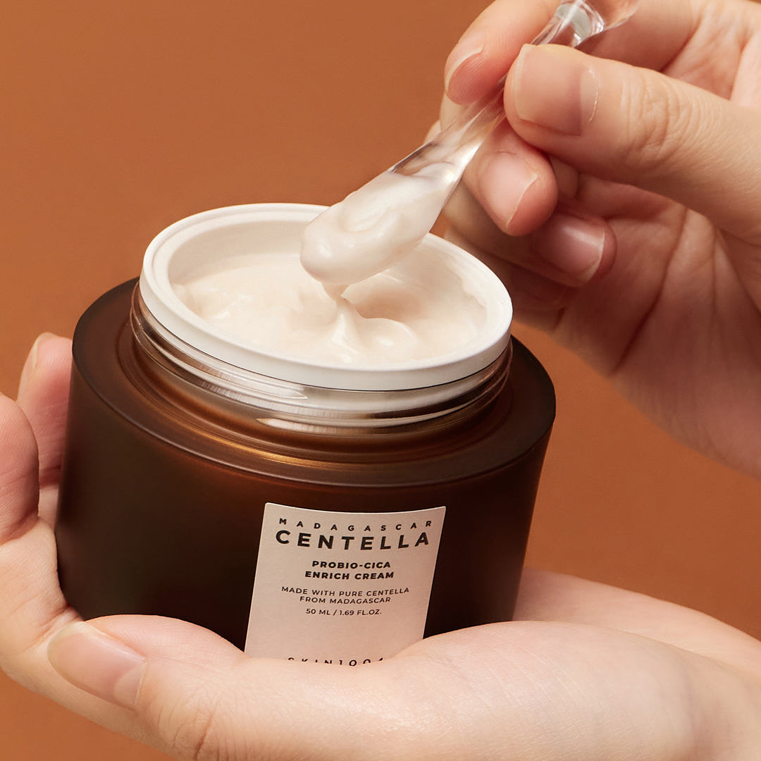 SKIN1004 Madagascar Centella Probio-Cica Enrich Cream scooped with spatula from jar