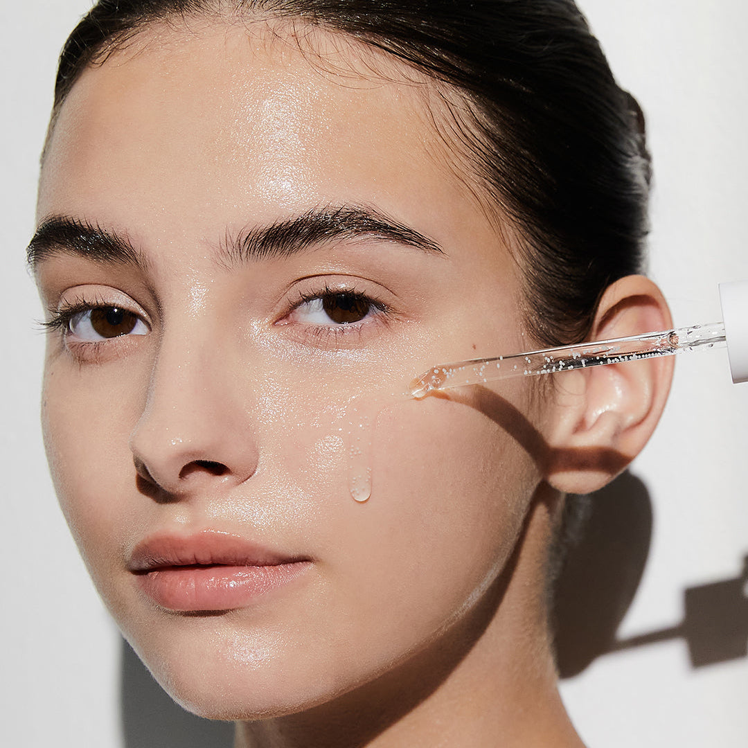 SKIN1004 Madagascar Centella Tone Brightening Capsule Ampoule applied on face with dropper