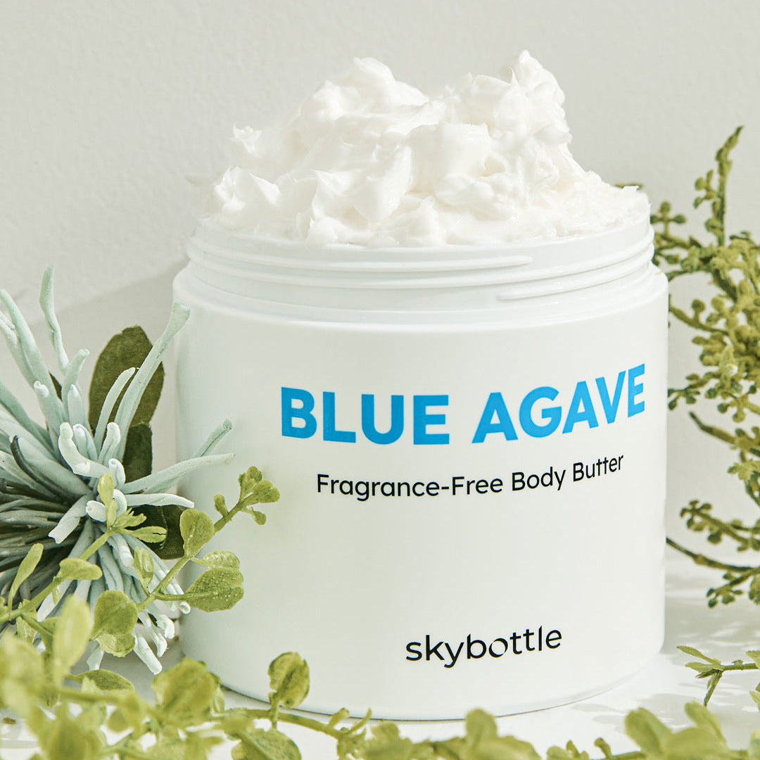 Skybottle Blue Agave Fragrance Free Body Butter jar on green grass background