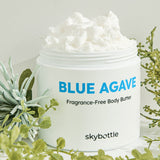 Skybottle Blue Agave Fragrance Free Body Butter jar on green grass background