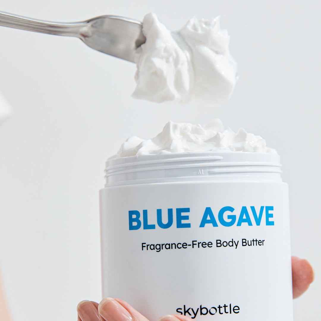 Skybottle Blue Agave Fragrance Free Body Butter 290ml scooped with spatula from jar
