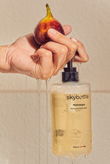 Skybottle Perfumed Body Wash Muhwagua 300ml bottle with fresh figs in background