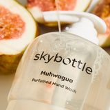 Skybottle Perfumed Hand Wash Muhwagua 300ml with soap pouring over bottle