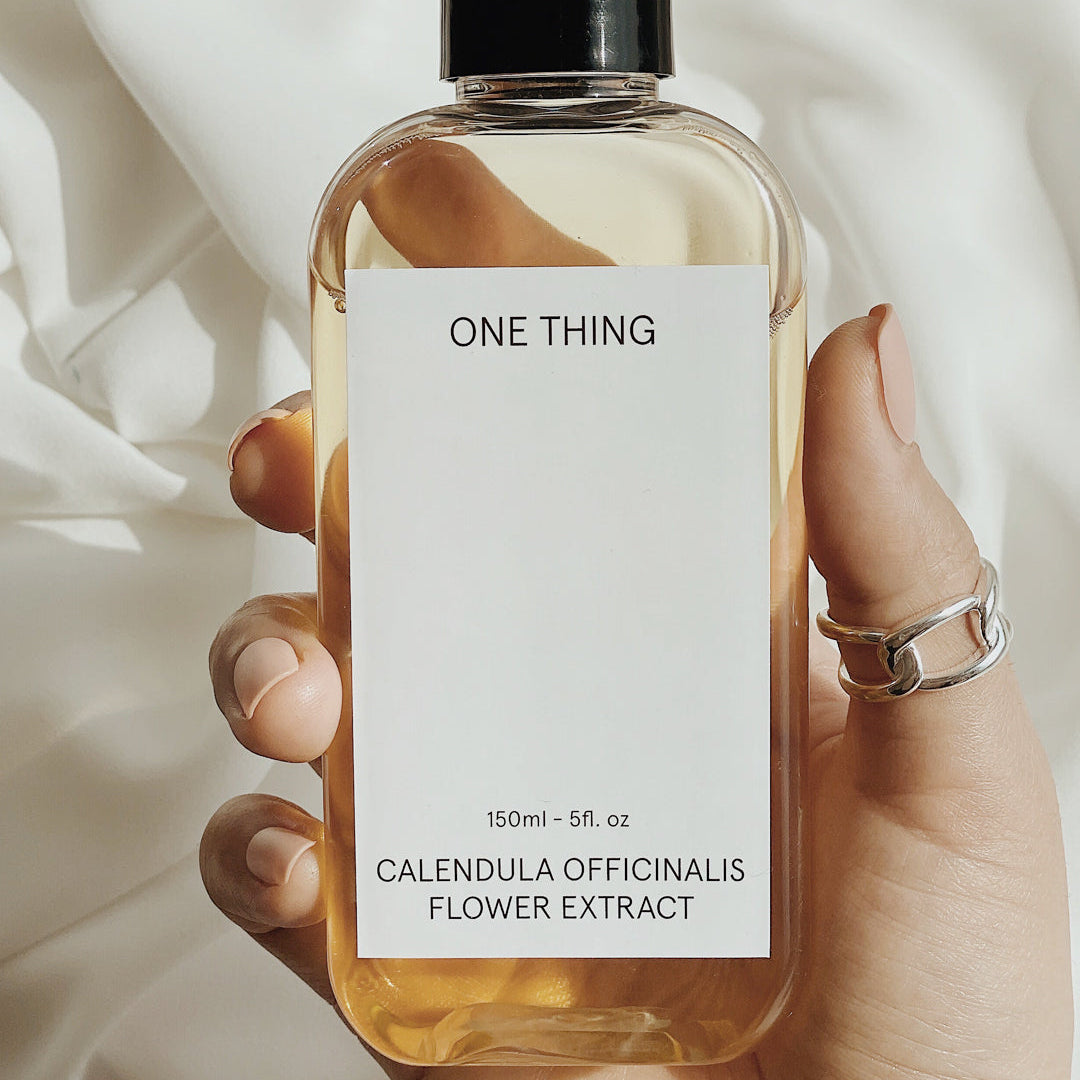 One Thing Calendula Officinalis Flower Extract 150ml held in hand