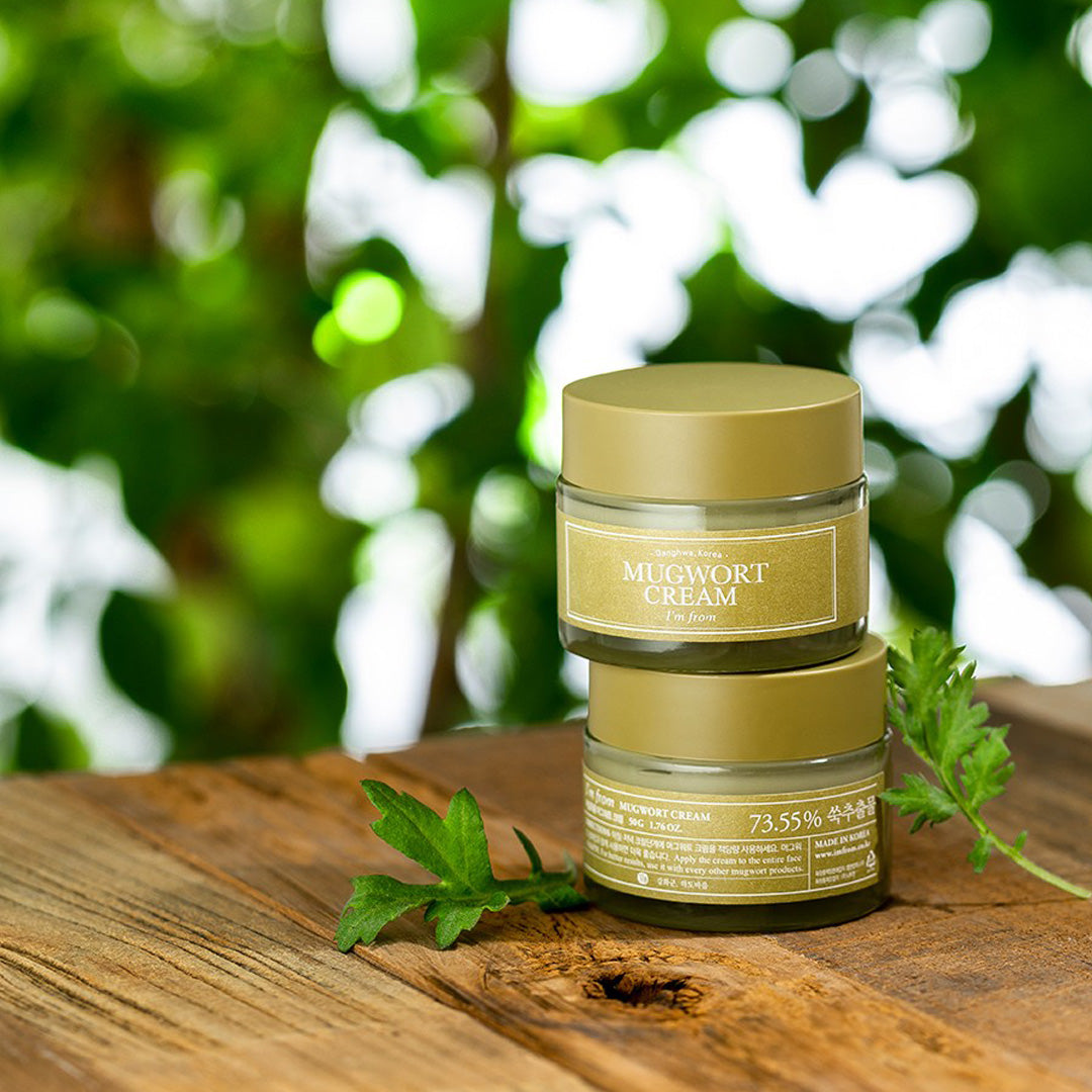 I'm From Mugwort Cream jar with mugwort leaves in background