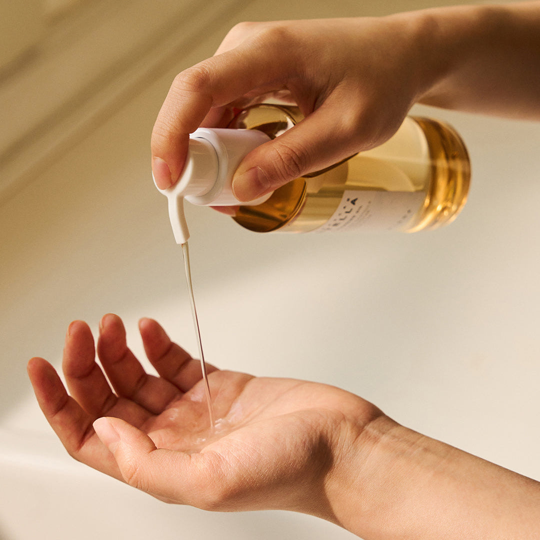 SKIN1004 Madagascar Centella Light Cleansing Oil being dispensed onto hand